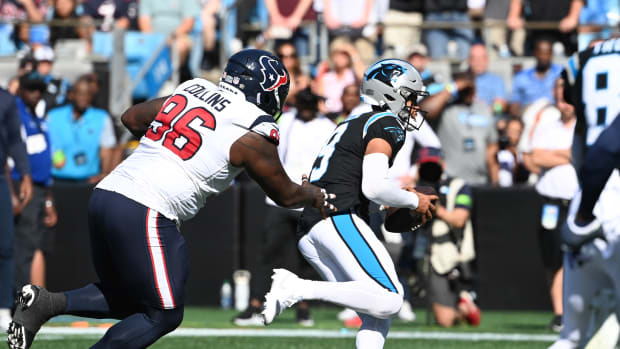 Oct 29, 2023; Charlotte, North Carolina, USA; Carolina Panthers quarterback Bryce Young (9) runs as Houston Texans defensive tackle Maliek Collins (96) defends in the second quarter at Bank of America Stadium. Mandatory Credit: Bob Donnan-USA TODAY Sports  